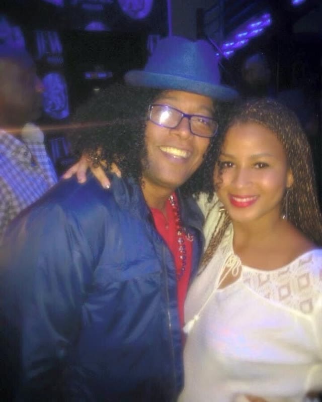 Rayma and Sergio Vargas, smiling at the camera during a night out in Punta Cana.